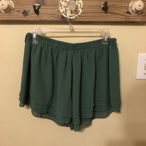 green flowy shorts